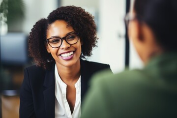 Black History Month, smiling African American business lady talking with coworker