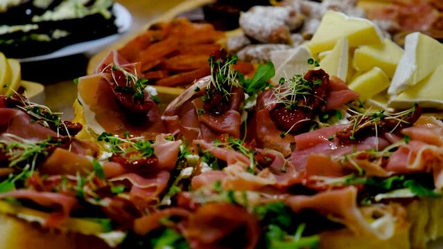 bruschetta with jamon on a plate. Selective focus.