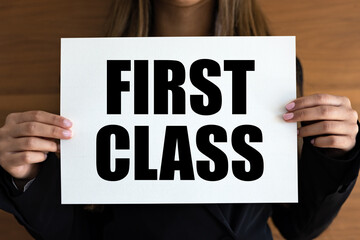 First Class. Woman with white page, black letters. Premium, VIP, business lounge, noble.