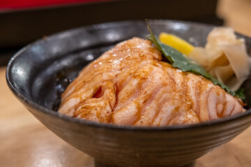 Grilled Salmon with rice, served in a bowl in the restaurant