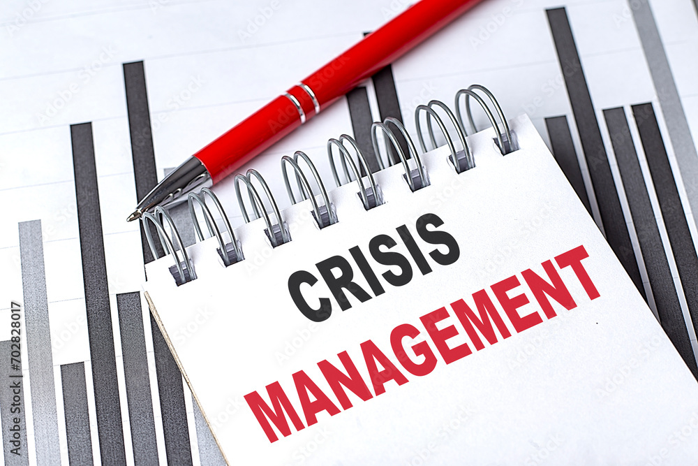 Poster crisis management text written on notebook with pen on chart