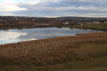 A body of water with a land in the background