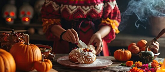Mexican woman baking bread called pan de muerto traditional from Mexico in Halloween. with copy space image. Place for adding text or design
