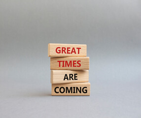 Great times are coming symbol. Concept words Great times are coming on wooden blocks. Beautiful grey background. Business and Great times are coming concept. Copy space.