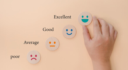 The hand holding the block shows a satisfied expression. Rating and evaluation of service provider...