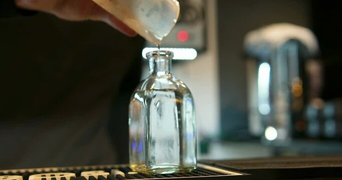 on the table near the poured glass of frozen vodka and pour into a glass of vodka