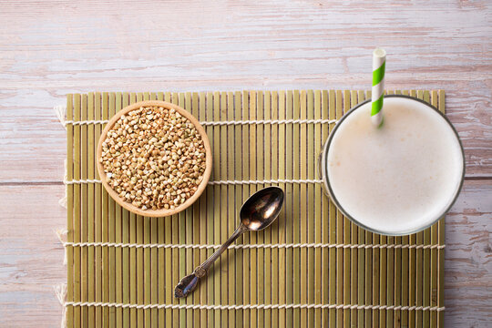Vegan Buckwheat milk and buckwheat groats.Non dairy alternative milk. Healthy vegetarian food and drink concept.Top view