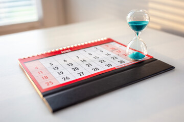 Hourglass on top of calendar