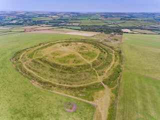 Aerial view of Castle an Dinas Iron Age hill fort in Cornwall from a drone