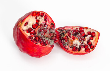 Spoiled red pomegranate with mold. Cut into two pieces. White background, isolated.