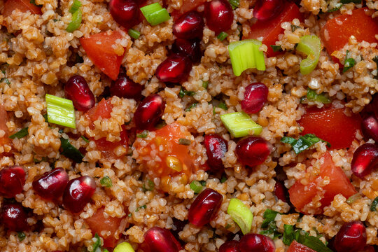 Close-up view of kisir - spicy Turkish bulgur wheat salad. Authentic Turkish side dish.