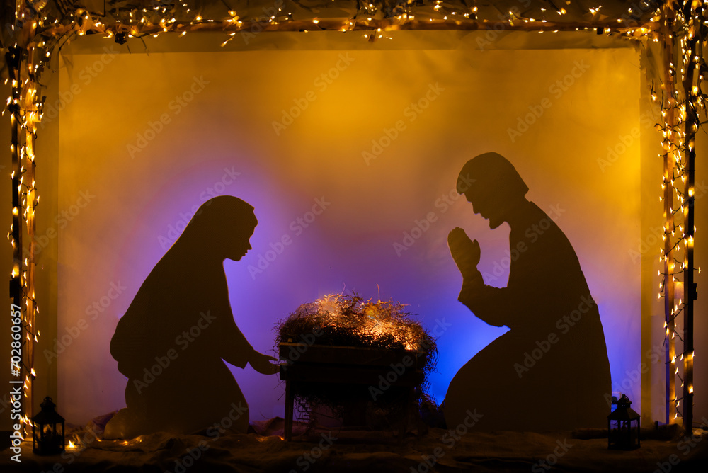 Poster wooden manger and star of bethlehem, joseph, mary silhouette, nativity scene background. christian c