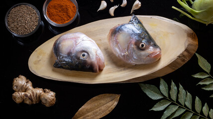 Fish heads getting prepared to be cooked.