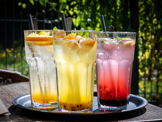 Home made lemonade in glasses on garden table