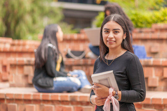 Portrait of Latina student in the outdoor area of her study center.