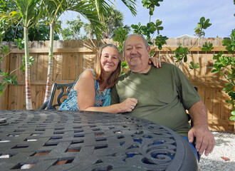senior adult couple at outside table