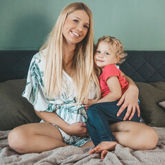 pregnant mother with her daughter waiting for brother