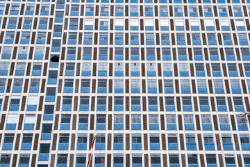 Broken window in office building