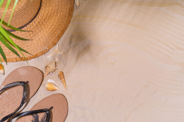 Summer sunny sand background with straw hat