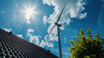 Sustainable Living. Green energy. At home production. Small Wind Turbine Harnessing Clean Energy atop a Rural House under the Radiant Sun