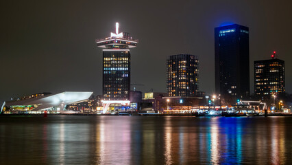 City scenic from Amsterdam at the IJ in the Netherlands by night