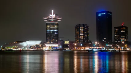 Foto auf Glas City scenic from Amsterdam at the IJ in the Netherlands by night © Nataraj