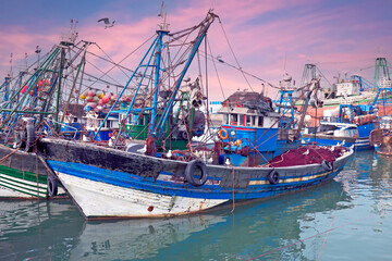 Fishing boats at the harbor from Essaouria. Essaouria is the most popular Atlantic coast city in Morocco Africa at sunset.