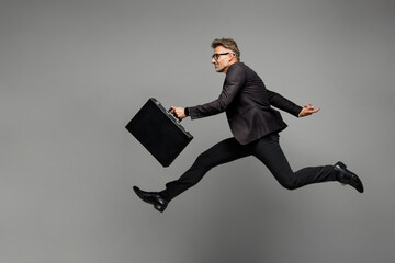 Full body adult successful employee business man corporate lawyer in classic formal black suit...