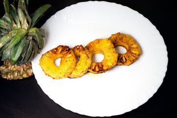 caramelized pineapple rings placed on a plate