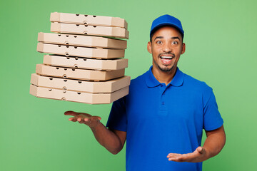 Surprised delivery guy employee man wear blue cap t-shirt uniform workwear work as dealer courier...