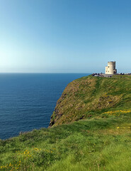 Fototapeta na wymiar Ireland. O'Brien's stone tower on the Cliffs of Moher in County Clare. 
