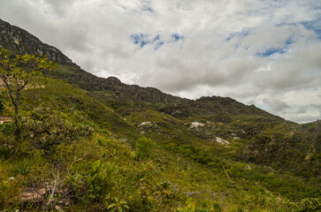 Naklejka premium Mountains in the state of Minas Gerais in Brazil. This region is inland and is called Lapinha da Serra and is part of the mountain range called Espinhaco. This mountain range is made up of high peaks,