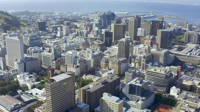 Drone of buildings, ocean and city background for urban development, travel and architecture or infrastructure. Aerial view of cityscape, commercial property and location of Cape Town, South Africa
