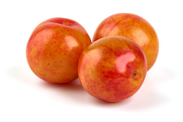 Yellow plums, isolated on white background.