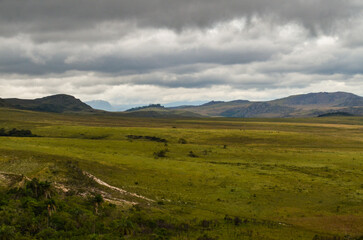 Mountains in the state of Minas Gerais in Brazil. This region is inland and is called Lapinha da Serra and is part of the mountain range called Espinhaco. This mountain range is made up of high peaks,