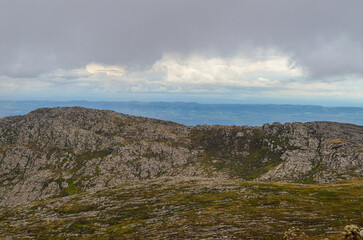 Mountains in the state of Minas Gerais in Brazil. This region is inland and is called Lapinha da Serra and is part of the mountain range called Espinhaco. This mountain range is made up of high peaks,