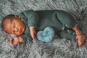 cosy sleeping newborn baby