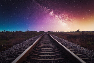Railway Track with Milky way in night sky. - obrazy, fototapety, plakaty