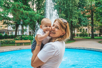 a mother happy with her baby on the park