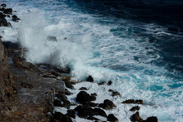 Wave splash on the cliff 