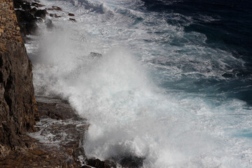 Wave splash on the cliff 