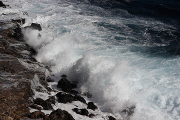 Wave splash on the cliff 