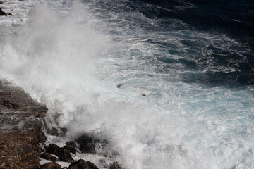 Wave splash on the cliff 