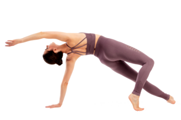 Young beautiful yoga sports woman is posing in studio, isolated