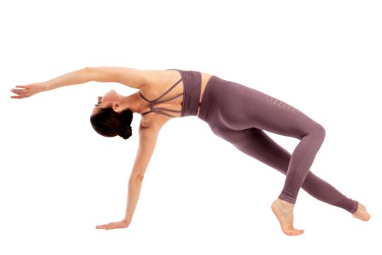 Young beautiful yoga sports woman is posing in studio, isolated