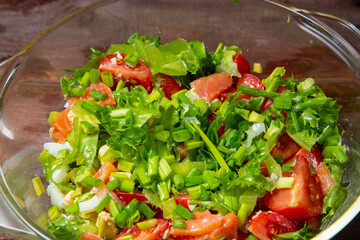 Vegetable salad avocado cherry tomato salted salmon boiled egg green onion close-up