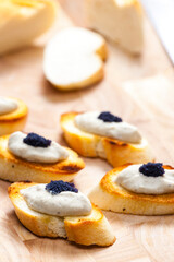 anchovy spread on toasted baguette slices