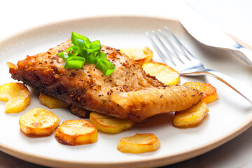 carp on cumin with fried potatoes