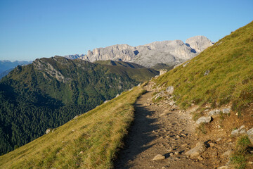 Wonderful and idyllic hiking trail in the italian dolomites in South Tyrol. View to Rosengarten Schlern Naturepark. Hiking at Sassolungo and Sassopiatto mountains