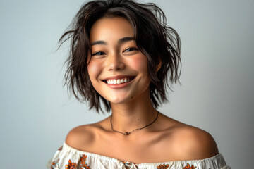 Pretty young Asian woman smiling.